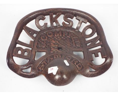 A cast iron tractor seat marked Blackstone &amp; Company Ltd, approximately 39 cm (l), appears in good condition (this does n