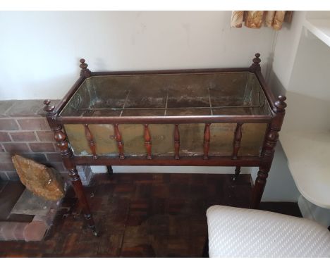 A turned mahogany and brass lined planter / jardiniere with eight internal compartments, approximately  74 cm x 84 cm x 44 cm