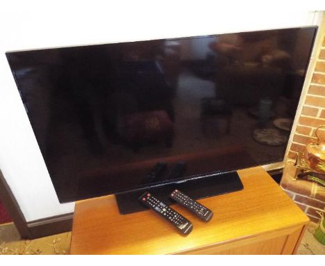 A Samsung flat screen LED T.V. 39 inch screen # UE40H5500AK and a Samsung 3D BluRay controller, both with remote controllers,