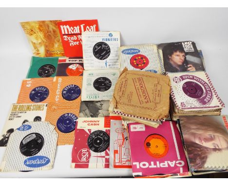 A collection of 7" vinyl records to include The Rolling Stones, The Animals, Meatloaf, Johnny Cash, The Clash, Deacon Blue, B