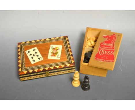 A Staunton Boxwood Chess set, House Martin, boxed; a hardwood playing-card box; James Bond playing cards 