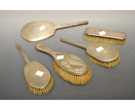 An Art Deco silver backed brush set, engine turned, Birmingham, 1938; others later (5)