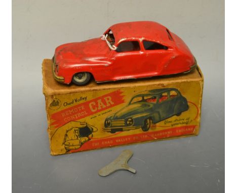 A Chad Valley harbourne clockwork car, boxed and key.