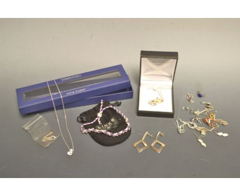 Jewellery -  a links of London silver and braided thread bracelet; a Swarowski free form crystal pendant;  another smaller;  