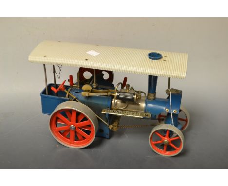 A live steam model traction engine, pale blue body, red wheels, 