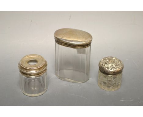 Three silver topped dressing table jars