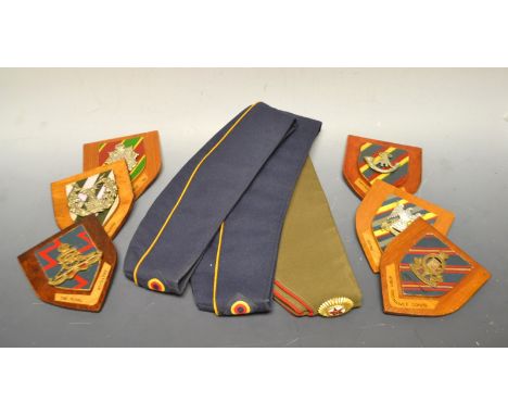A Russian Soviet cap; others; mounted badges, Oxfordshire and Buckinghamshire Light Infantry; Royal Scots; Gordon Highlander'