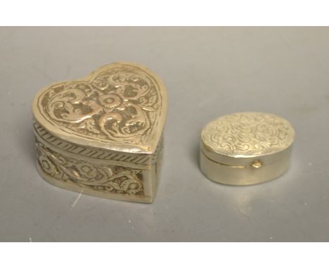 A Victorian heart shaped silver patch box; an oval silver patch box