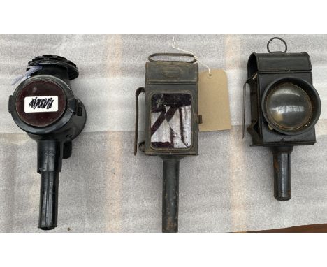 Two black painted rear lamps and a lantern