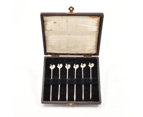 Set of six hallmarked silver cocktail sticks. The cocktail sticks having moulded cockerel / chicken motifs to the finial. Hal