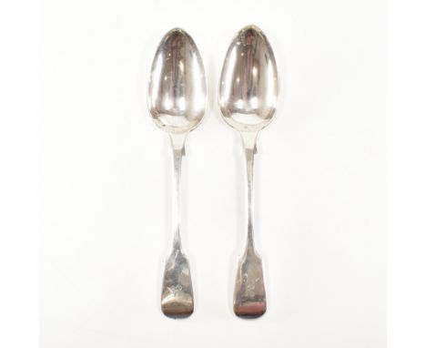 A pair of 19th Century Victorian hallmarked silver serving spoons. The spoons having a fiddle pattern to the shoulders and a 