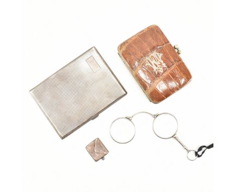 An assortment of items. Lot to include a crocodile skin wallet. The wallet having a silver emblem to the front. A silver ciga