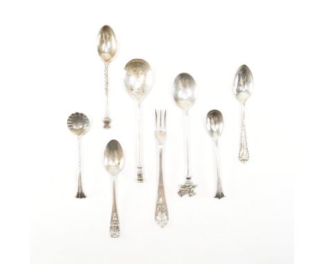 A collection of assorted 19th and 20th Century silver hallmarked teaspoons and cruet spoons. The lot to include a shell form 