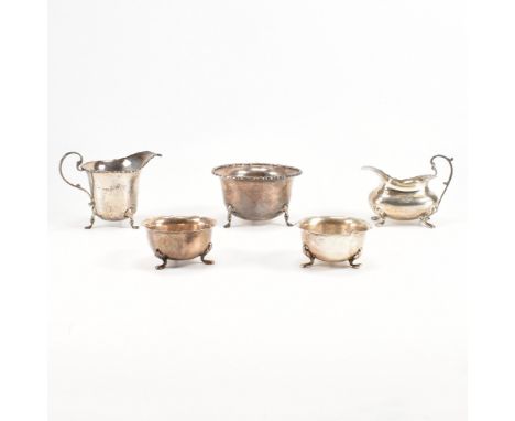 An assorted collection of Victorian &amp; later hallmarked silver cabriole footed items. The lot to include a pair of petal e