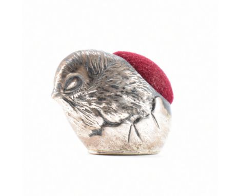 A sterling silver &amp; velvet pin cushion. The pin cushion formed in the shape of a bird. Total weight approx 6.2g. Measures