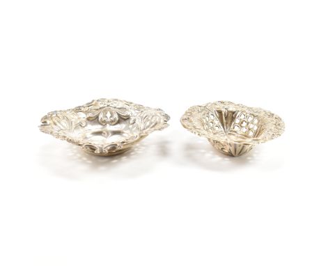 Two Victorian hallmarked silver pin dishes. The larger dish having a pierced foliate pattern to the sides and heart shaped ba
