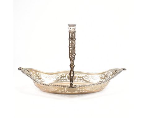 A hallmarked silver fruit basket. The basket in lozenge form with moulded repeating &amp; scrolling patterns to the rim, pier