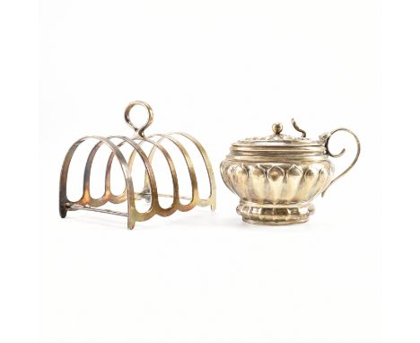 A silver hallmarked toast rack, together with an antique silver hallmarked condiment pot. The toast rack comprising of D form