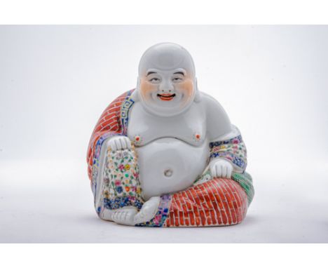 Republican Period, Ca. AD 1912-1949 .A Chinese porcelain buddha. The content seated figure is wearing a robe decorated with b