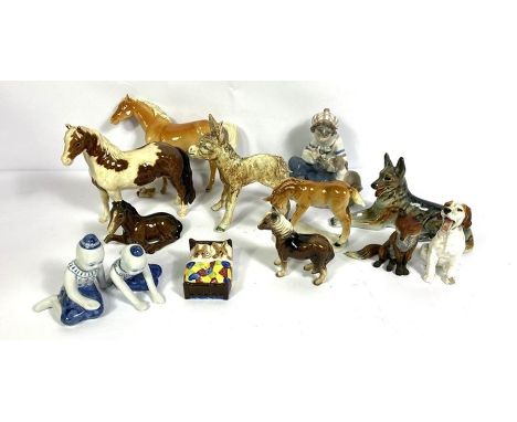 A group of assorted ceramic animals, and figurines, including Horses, a Donkey, a German Shepherd and a Lladro figure of a bo