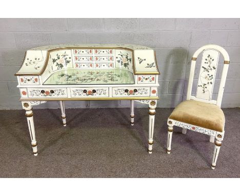 A modern Carlton House desk, painted in the chinoiserie style, of typical form with curved black and set on four turned legs,