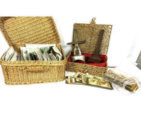 A quantity of ephemera, including a basket of postcards; A stereoscopic slide viewer and a small selection of vintage slides 