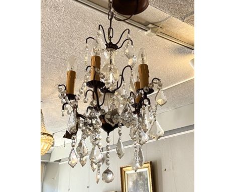 A vintage glass chandelier, with five lights and multiple pendant glass drops
