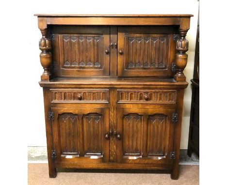 Assorted furniture, including a two door cabinet, with associated bookcase top; also a vintage oak court cupboard (2)