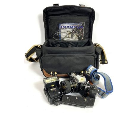 A vintage Olympus OM10 camera, with a Miranda Macro lens, assorted filter and components, in a camera bag (a lot)