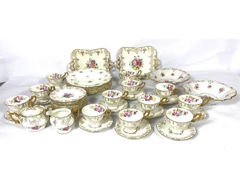 A large assortment of of ceramic tea services, including a Royal Crown Derby twelve place part service, decorated with roses 