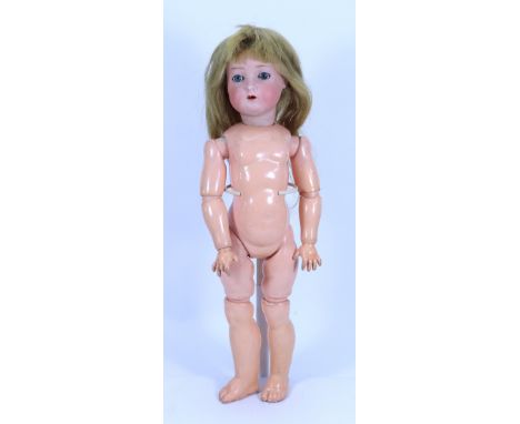 A Simon & Halbig 403 bisque head doll, German circa 1910, with weighted blue glass eyes, painted lashes and brows, open mouth