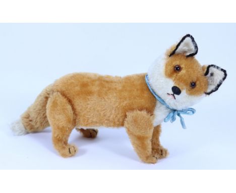 A rare Steiff mohair jointed fox, German circa 1910, the straw filled orange and white fox with swivel head and jointed legs,