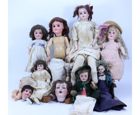 A collection of dolls for repair/restoration, including a large German bisque shoulder head doll, on kid leather body, bisque