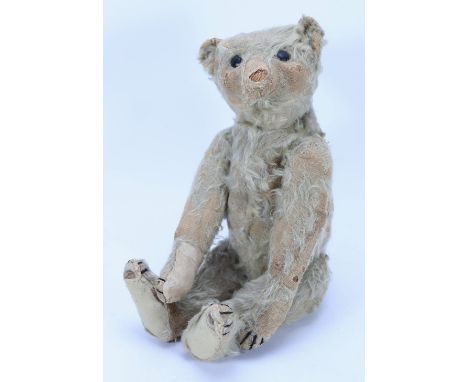 A rare Strunz mohair rod jointed Teddy bear, German 1904-06, the white straw stuffed bear with large black boot button eyes, 
