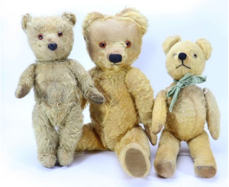 Three post war English Teddy bears, including a large Chad Valley golden mohair bear with orange glass eyes, black stitched n