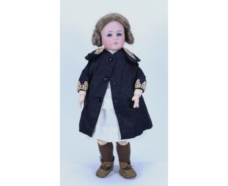 A Kammer & Reinhardt 117 bisque head character doll, German circa 1910, with weighted blue glass eyes, painted and real lashe