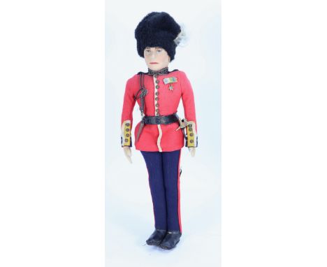 A King George VI Alpha Farnell cloth doll in Guards uniform, English circa 1937, the moulded felt head with nicely painted bl