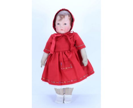 A Kathe Kruse cloth Doll I, German circa 1910, the moulded muslin head with oil painted features, short brown hair with wisps