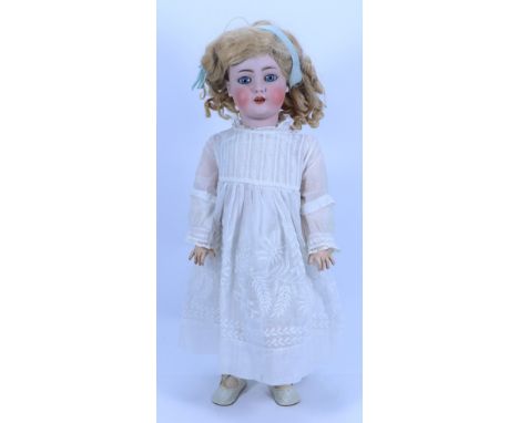 A Simon & Halbig 1078 bisque head doll, German circa 1910, with weighted blue glass eyes, painted lashes and feather brows, o