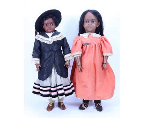 A rare Simon & Halbig 1249 ‘Santa’ black bisque head doll, German circa 1910, with weighted brown glass eyes, open mouth with