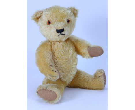 A good Chad Valley golden mohair Magna Teddy bear, 1930s, with orange glass eyes, small wide set ears and horizontally stitch