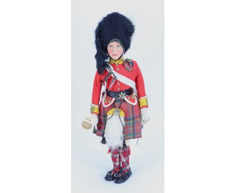 A King George VI Alpha Farnell cloth doll in Highland Guard uniform, English circa 1937, the moulded felt head with nicely pa