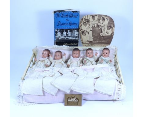 A set of Madame Alexander Dionne Quintuplets composition baby dolls, circa 1936, in original cream painted bed with pillow, m