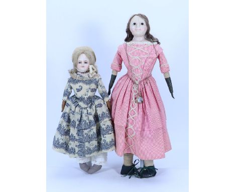 Two wax over composition shoulder head dolls, English 1860s, the first with inserted black glass eyes, painted mouth and slit
