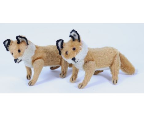 A rare pair of small Steiff mohair jointed fox cubs, German circa 1910, the straw filled orange and white fox cubs with swive