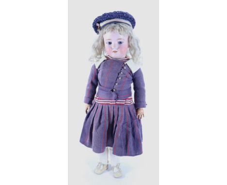 A Heinrich Handwerck 109 bisque head doll, German circa 1910, the pale bisque head with blue glass ‘flirty’ eyes, painted las