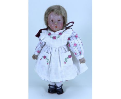 A small Kathe Kruse cloth doll VII, German 1930s, the moulded  hollow head with painted features, blonde hair and swivel neck