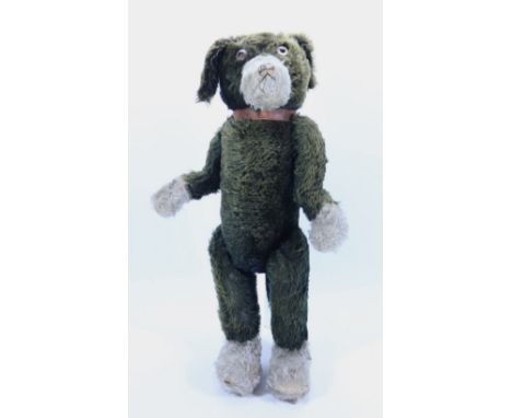 A large J.K Farnell ‘Pip’ the dog English 1920s, the black mohair dog with white muzzle and paws, glass eyes, black stitched 