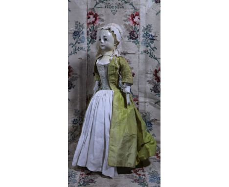 ‘Miss Penelope’ an important early English carved wooden doll with provenance, circa 1720, the finely carved painted gesso fa