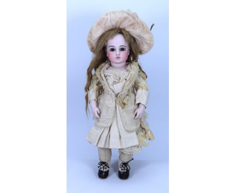 *A Leon Casimer Bru circle dot bisque head Bebe doll,  French circa 1880, the beautiful pale bisque head with plump cheeks la
